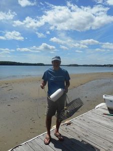 Oyster Conservationist volunteer excited to receive his baby oysters. © The Nature Conservancy
