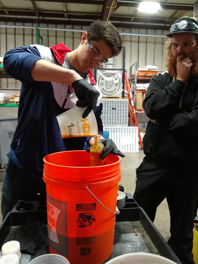 Students taking samples to measure nutrient load from fermenters at Stoneface Brewing Co. The Brewery sidesteams so that it does not go down the drain. Photo: Cheryl Parker