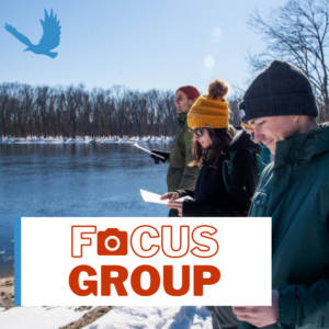 Students reading handout and looking at river in winter